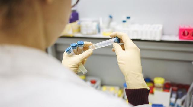 person-holding-test-tubes-3735747.jpg